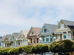 a row of houses in front of each other